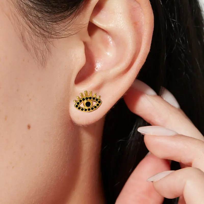 Stux les yeux des boucles d'oreilles avec des pierres noires